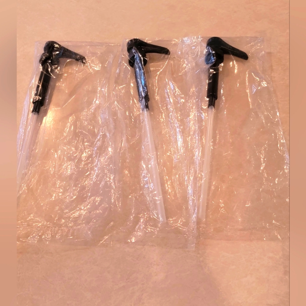 Set of 3 brand new syrup pumps sealed in bags